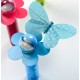 Papillons turquoise à pois sur tige les 6
